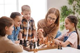 Kids learning chess with coach